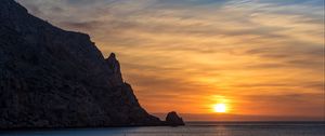 Preview wallpaper rock, sea, sunset, horizon, dark