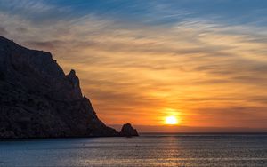 Preview wallpaper rock, sea, sunset, horizon, dark