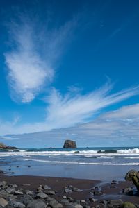 Preview wallpaper rock, sea, waves, foam, shore, pebbles, landscape