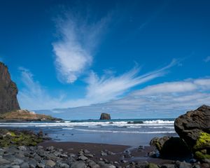 Preview wallpaper rock, sea, waves, foam, shore, pebbles, landscape