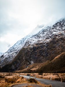 Preview wallpaper rock, slope, road, snow, snowy, fog