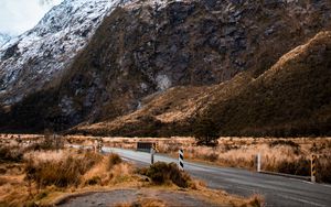 Preview wallpaper rock, slope, road, snow, snowy, fog