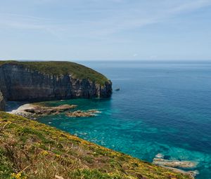 Preview wallpaper rock, slope, sea, grass, sky