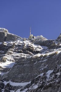 Preview wallpaper rock, snow, relief, tower, sky
