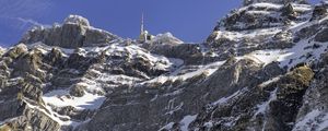 Preview wallpaper rock, snow, relief, tower, sky