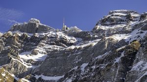 Preview wallpaper rock, snow, relief, tower, sky