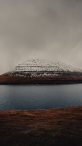 Preview wallpaper rock, snow, snowy, sea, grass