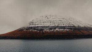 Preview wallpaper rock, snow, snowy, sea, grass