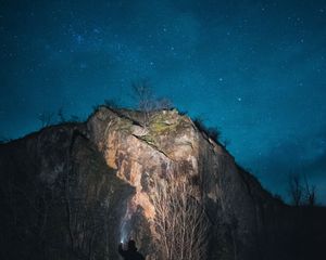 Preview wallpaper rock, stars, sky, man, silhouette, alone, light