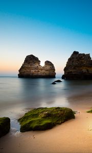 Preview wallpaper rock, stone, beach, sea, twilight