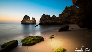 Preview wallpaper rock, stone, beach, sea, twilight