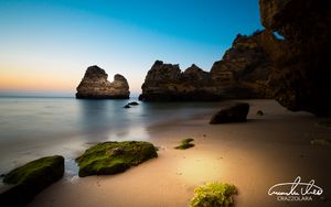 Preview wallpaper rock, stone, beach, sea, twilight