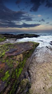 Preview wallpaper rock, stone, sea, sunset, sky