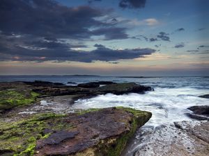 Preview wallpaper rock, stone, sea, sunset, sky