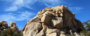 Preview wallpaper rock, stone, stony, bushes, sky