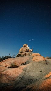 Preview wallpaper rock, stones, man, night, nature