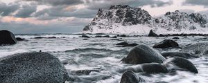 Preview wallpaper rock, stones, waves, snow, shore