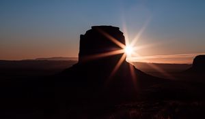 Preview wallpaper rock, sun, sunset, dark, landscape