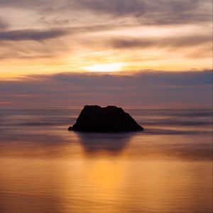 Preview wallpaper rock, sunset, ocean, horizon