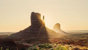 Preview wallpaper rock, valley, rays, sand, bushes