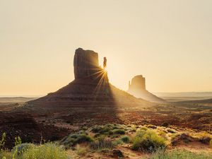 Preview wallpaper rock, valley, rays, sand, bushes