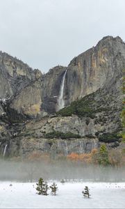Preview wallpaper rock, waterfall, snow, trees, fog, nature