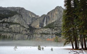 Preview wallpaper rock, waterfall, snow, trees, fog, nature