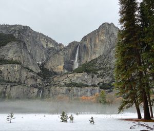 Preview wallpaper rock, waterfall, snow, trees, fog, nature