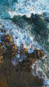 Preview wallpaper rocks, aerial view, sea, foam, stones