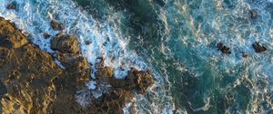 Preview wallpaper rocks, aerial view, sea, foam, stones