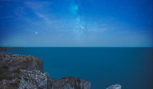 Preview wallpaper rocks, arch, sea, starry sky, horizon, night