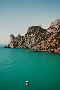 Preview wallpaper rocks, boat, ocean, sky