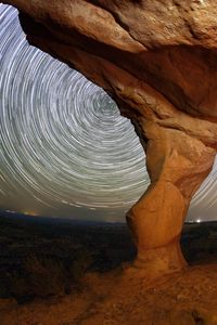 Preview wallpaper rocks, canyon, stars, long exposure, rotation, night