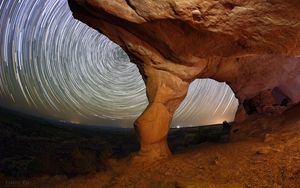 Preview wallpaper rocks, canyon, stars, long exposure, rotation, night