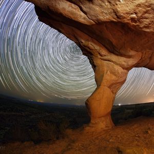 Preview wallpaper rocks, canyon, stars, long exposure, rotation, night