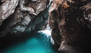 Preview wallpaper rocks, cave, gorge, body of water, water, nature
