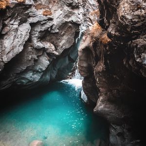 Preview wallpaper rocks, cave, gorge, body of water, water, nature