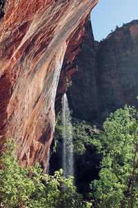 Preview wallpaper rocks, cliff, waterfall, trees, bushes