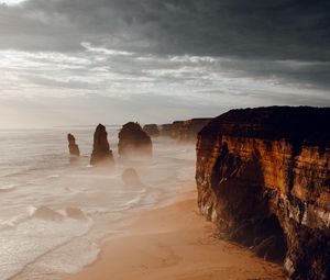 Preview wallpaper rocks, coast, sand, water, waves, aerial view, nature