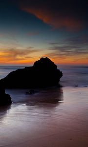 Preview wallpaper rocks, coast, sea, evening, dark