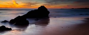 Preview wallpaper rocks, coast, sea, evening, dark