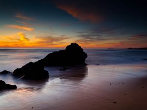 Preview wallpaper rocks, coast, sea, evening, dark