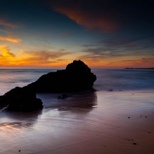 Preview wallpaper rocks, coast, sea, evening, dark