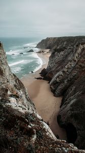 Preview wallpaper rocks, coast, sea, surf, sand