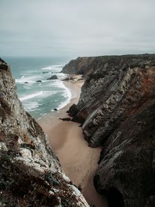 Preview wallpaper rocks, coast, sea, surf, sand