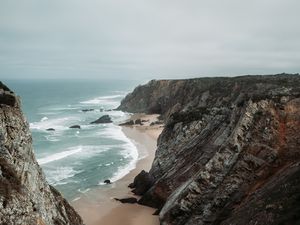 Preview wallpaper rocks, coast, sea, surf, sand