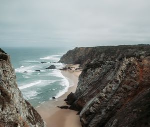 Preview wallpaper rocks, coast, sea, surf, sand