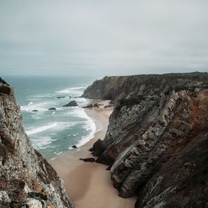 Preview wallpaper rocks, coast, sea, surf, sand