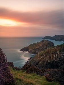 Preview wallpaper rocks, coast, sea, grass, horizon