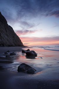 Preview wallpaper rocks, coast, sea, stones, water, sunset